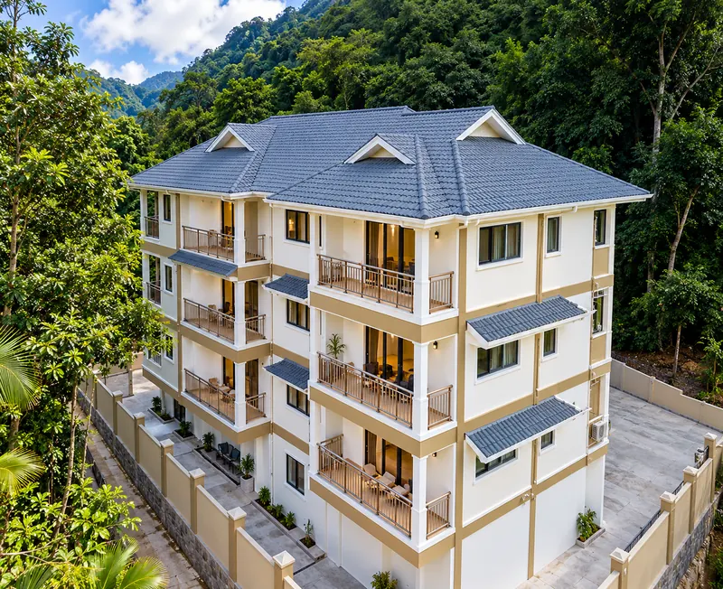 Aerial view of a hillside apartment and storage block