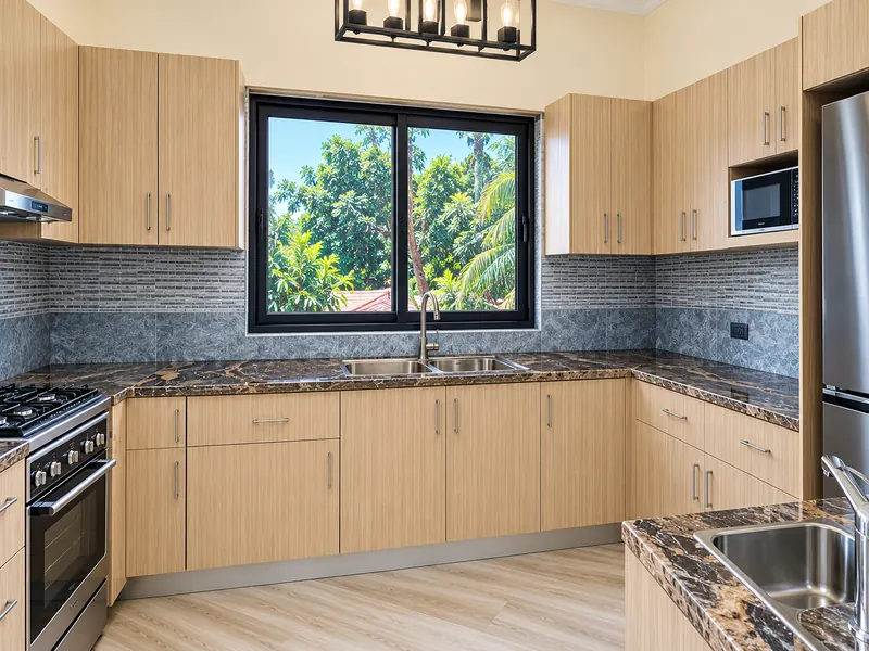 U-shaped kitchen with garden views