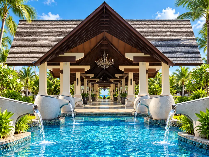 Symmetrical resort entrance pavilion with water features
